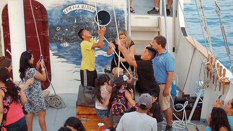 Sail tour participants on the deck of Tall Ship Windy