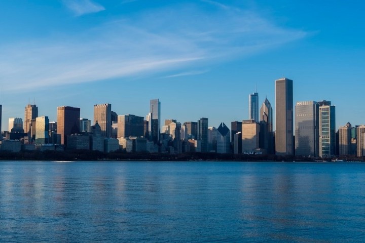 a large body of water with a city in the background